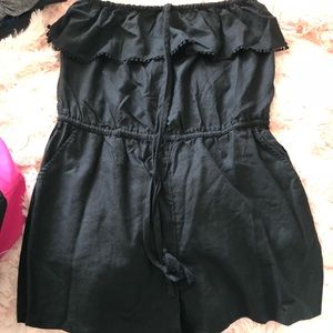 Black strapless romper with fringe